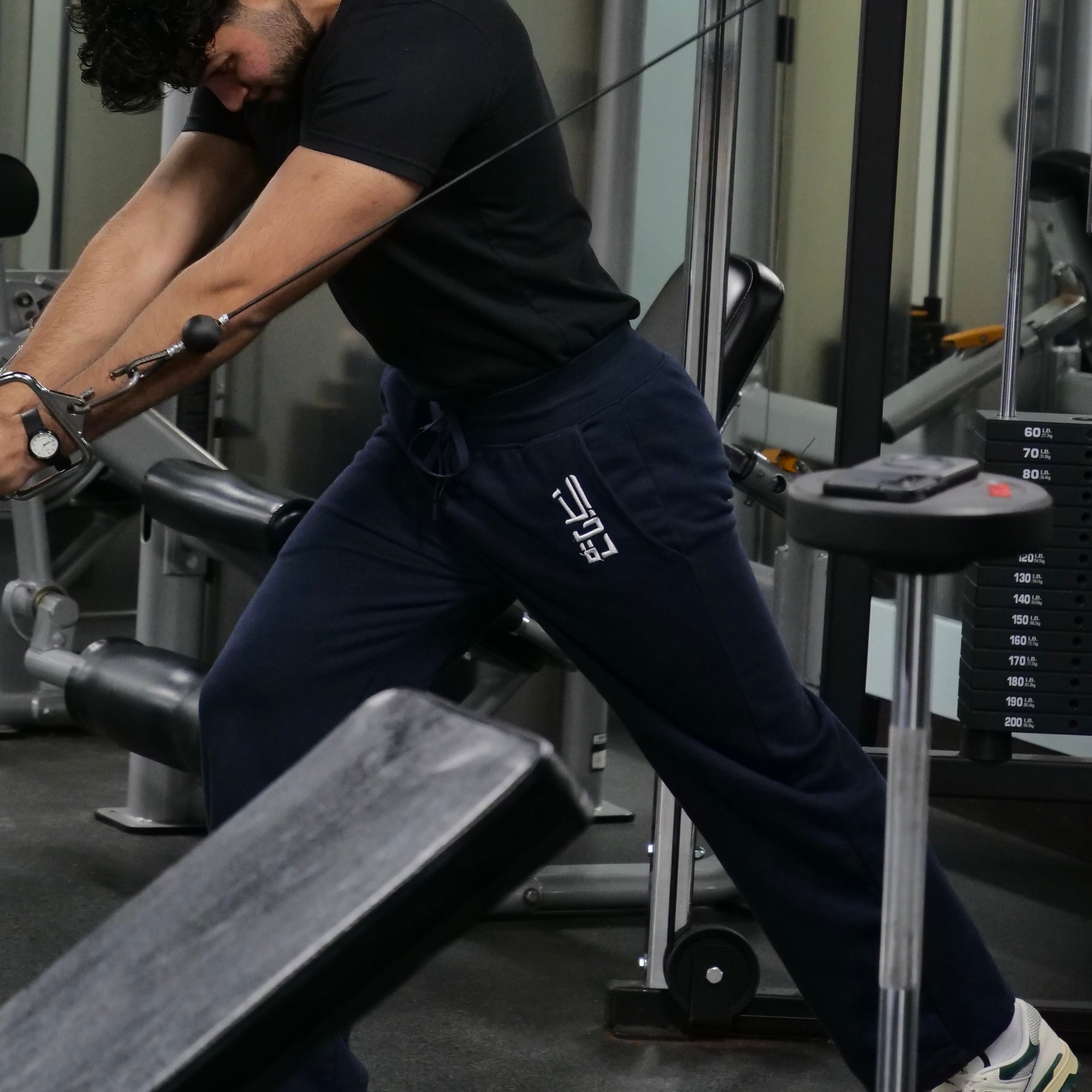 Side angle of full-length pants showing awrah coverage